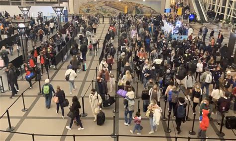 How many people are expected to travel through DIA this Thanksgiving?